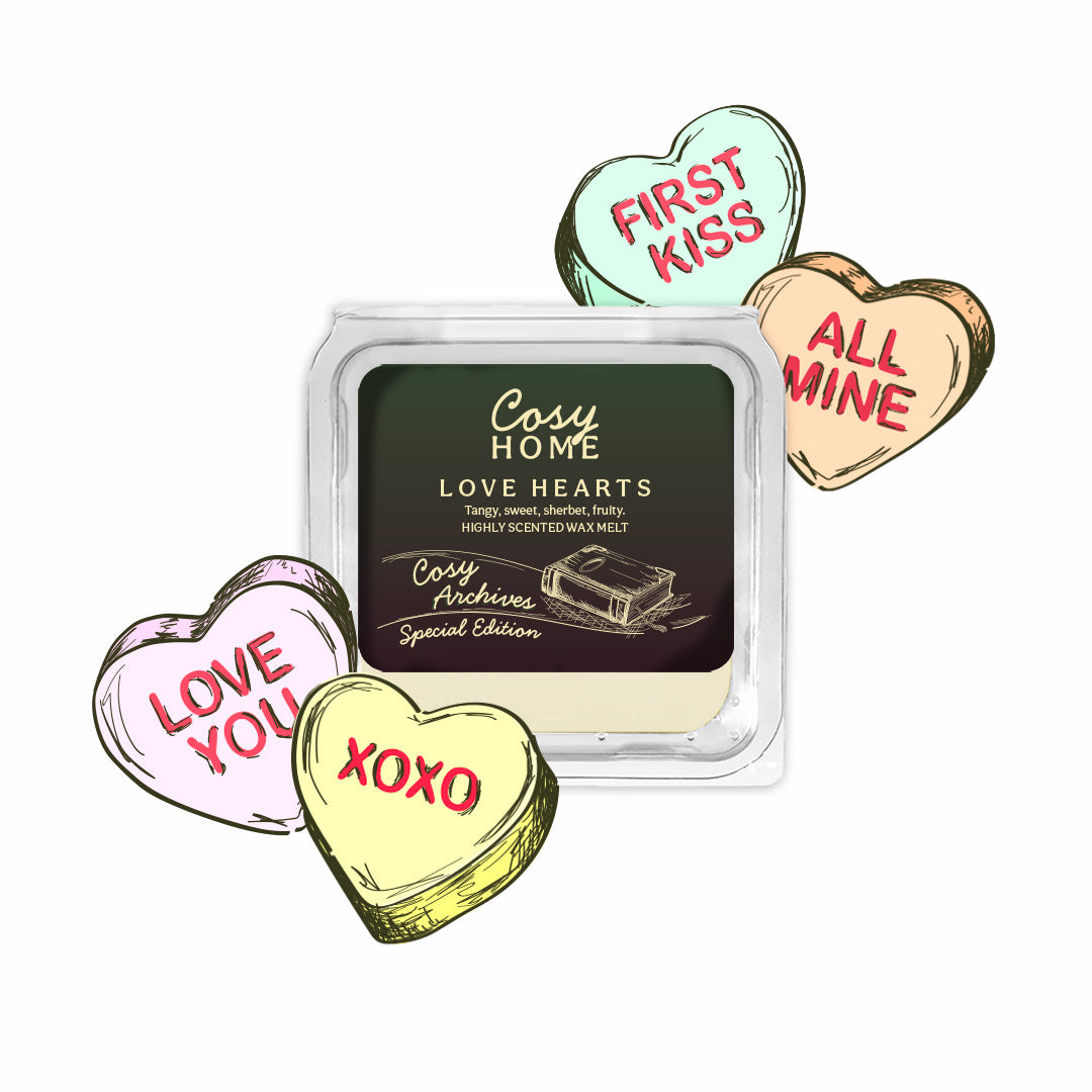 Cosy Home love heart-shaped wax melts with a clear container on a white background
